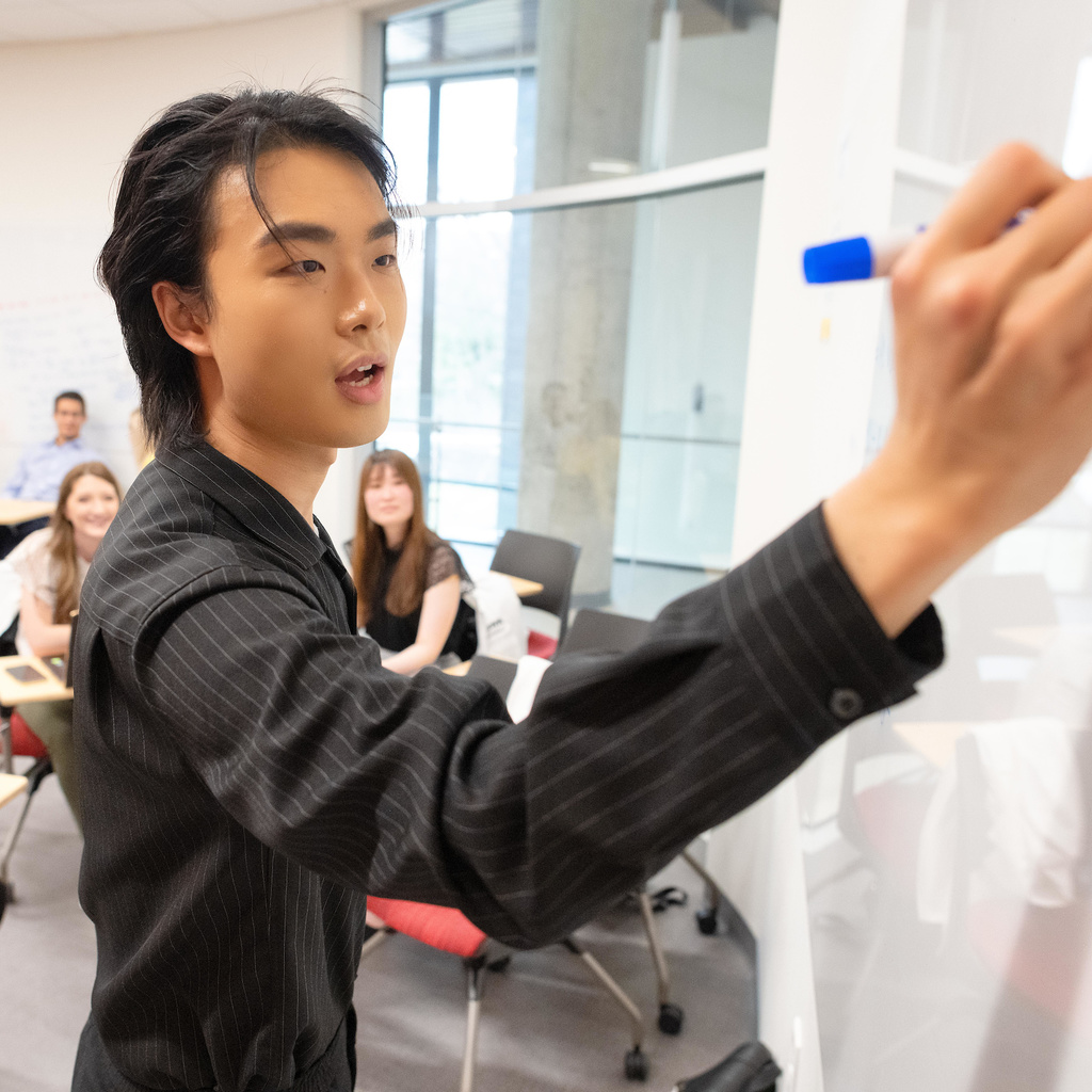 Students working on a whiteboard